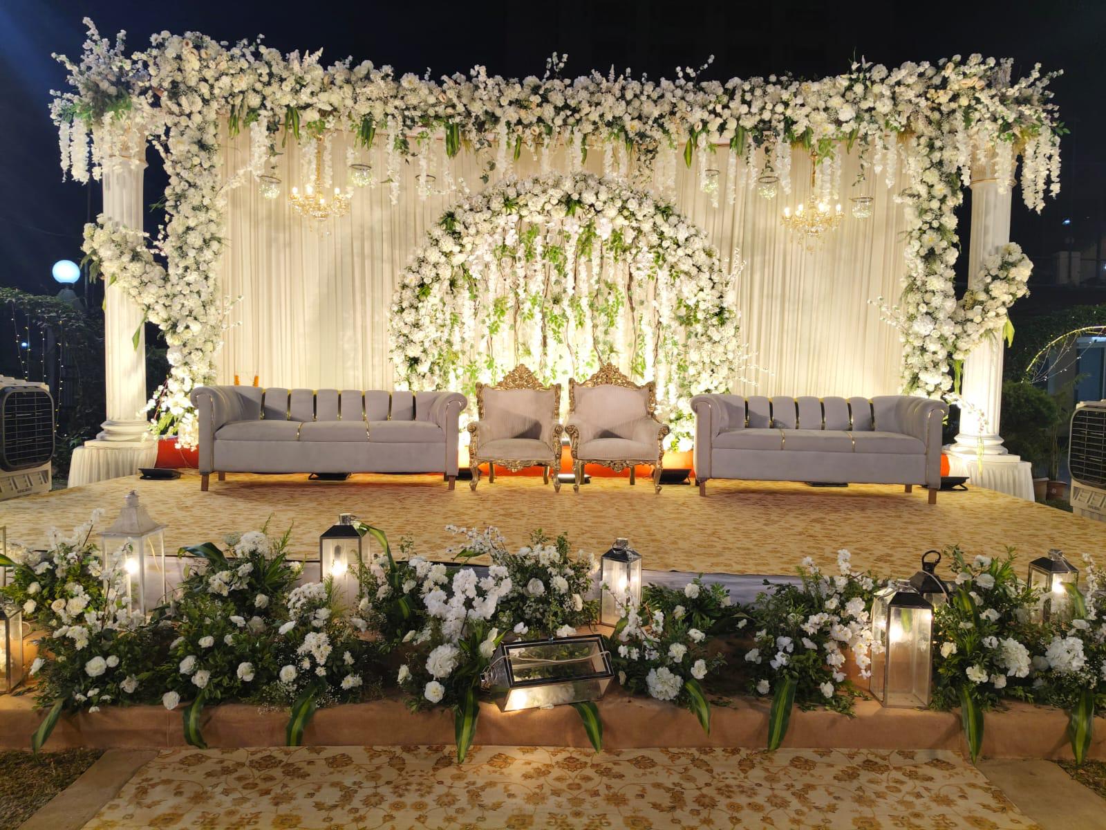 Grand cascading white floral canopy stage