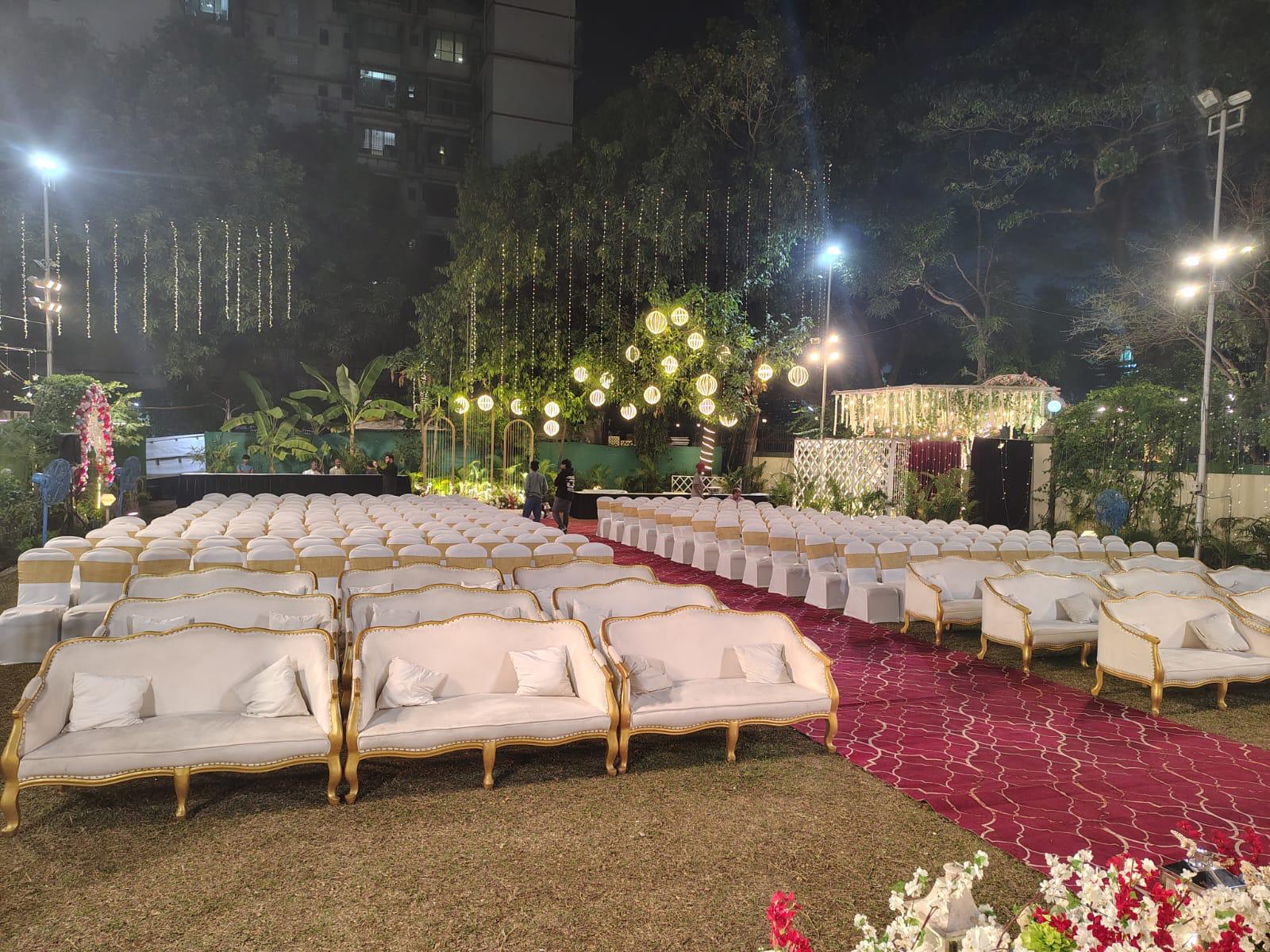 Night outdoor lawn seating with comfortable white sofas